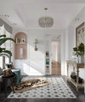 Stylish entryway with decorative chandelier, plants, and open sliding door leading to a bright room.