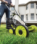 Manual Push Reel Lawn Mower With 20-Inch Cutting Width, 9-Position Height Adjustment, 8.5-Gallon Grass Catcher, Lightweight Eco Friendly Yard Care Machine For Quiet, Gas-Free Mowing And Easy Lawn Maintenance, used on a home lawn