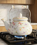 Vintage Floral Enamel Tea Kettle 2.6 Quart With Porcelain Handle For Stovetop Kitchen Camping And Home Gifts Perfect For Housewarming Wedding Bridal Shower Mothers Day Non Toxic Durable Fast Heating And Rust Resistant on stove