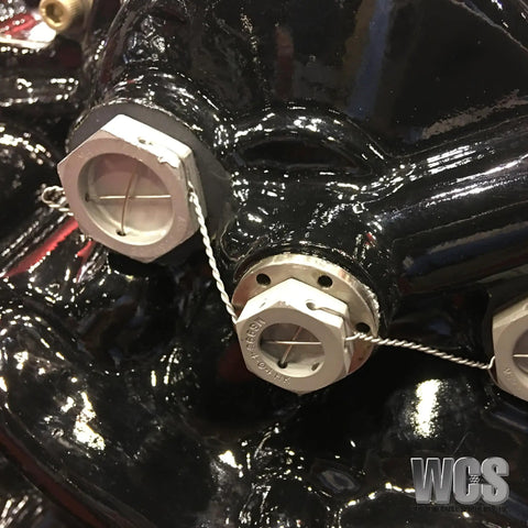 Close-up of machinery secured with 10.5 Inch Safety Wire Pliers With One Pull Action Wire Twister And Stainless Steel Cutter