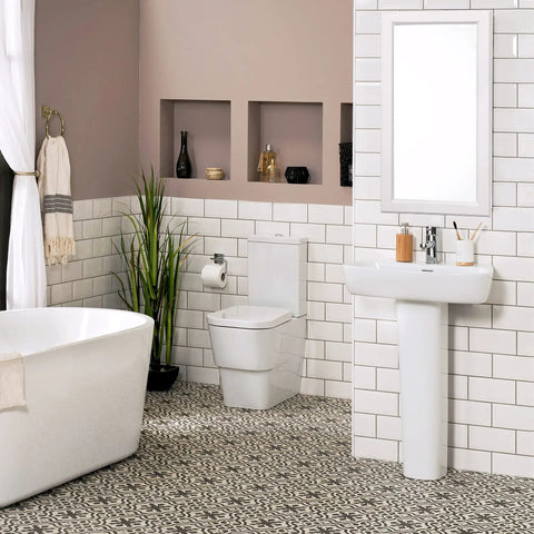 White bathroom with wall-mounted cabinet mirrored door above sink