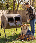 Man using Dual Chamber Compost Bin With 360 Degree Rotating Tumbler 37.5 Gallon Outdoor Bin On Sturdy Metal Stand Lockable Doors BPA Free Plastic for yard waste