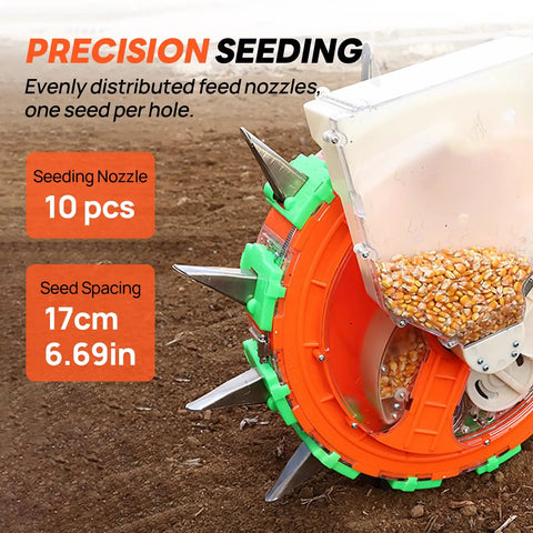 Close-up of Hand Push Seeder With Visible Seed Hopper showing 10 stainless steel duckbill seed dispensers on soil.