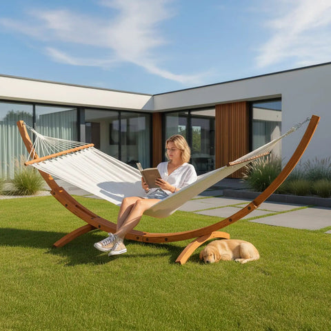 Wood Arc Hammock Stand With Double Hammock For Outdoor Use Natural Wooden Frame Supports Up To 330 Lbs 14 Feet Long with person lounging