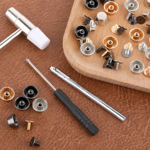 Heavy Duty Brass Screw Back Purse Feet And Metal Rivets For Handbag Bottom Protectors With Punch And Screwdriver Included No Sweat Install For DIY Leather Craft Gear tools and accessories on brown leather surface