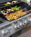Open gas grill with assorted vegetables and meat cooking, compatible with Universal AA Battery Push Button Igniter For Gas Grills Replacement 7 Outlet Rotary Ignition Mount Plug And Play Easy Install Compatible With Char Broil Nexgrill Brinkmann Blackstone Griddle.