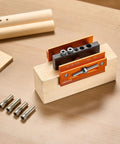 Knockout Self Centering Dowel Drill Jig Kit For Woodworking With Adjustable Width Clamps and Precision Guide Bushings crafted from heavy duty aluminum on wood.