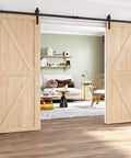 12 Foot Heavy Duty Sliding Barn Door Hardware Kit For Double Doors With Slick Quiet Glide Easy To Install And Reusable Fits Doors One And Three Eighths Inches Thick To One And Three Quarters Inches Thick Thirty Six Inches Wide Black I Shape installed on light wood doors in living room