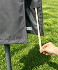 Close-up of All-Weather 6ft To 9ft Patio Umbrella Cover With Zipper And Rod, dark grey, showing zipper and rod.