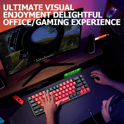 Solid Compact 68 Key Wired Keyboard With Butter Smooth Tactile Keys Dope Rainbow Rgb Backlights Plug And Play Gaming Rig For Pc Mac Ps4 Ps5 Travel Office Typing Red Black on a desk with a person gaming.