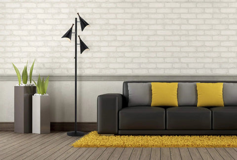 Dual Bulb Desk Lamp With Brushed Steel Base And Black Shade Adjustable Brightness For Home Office Or Bedroom Modern Industrial Style With Wood Accent Great Reading And Task Lighting next to a modern sofa and yellow cushions