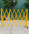 Heavy Duty Expandable Safety Barrier Gate, Rock Solid Retractable Metal Traffic Barricade Fence For Driveways, Warehouses, And Job Sites Built Tough To Take A Beating And Withstand Rough Weather, yellow, retractable, standing open.
