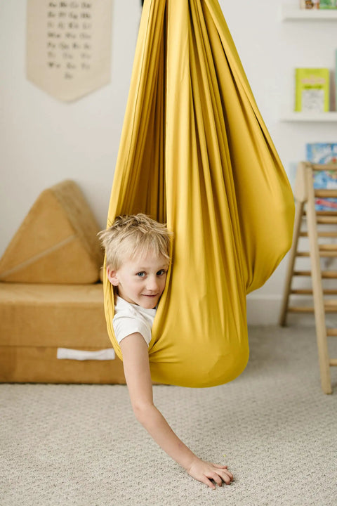 Child in indoor outdoor double layer cotton sensory swing for kids with special needs therapy and vestibular play
