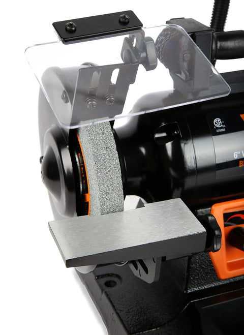Close-up of Top Shelf 6 Inch Bench Grinder With 2.5 Amp Variable Speed Motor and Built In Work Light for sharpening blades.