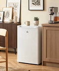 Sweet 3 Cu Ft White Upright Freezer with Reversible Door in a cozy kitchen setting, ideal for apartments and dorms.
