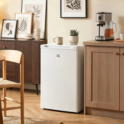 Roomy 3 Cubic Foot Upright Freezer With Reversible Door And Hassle Free Adjustable Thermostat In Clean White positioned in a cozy kitchen.