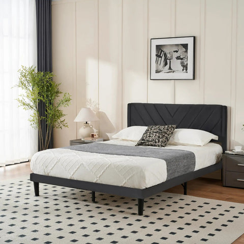 Queen Size Platform Bed Frame With Velvet Headboard And Wing Edge Design Crafted From Solid Wooden Slats For Legit Noise Free Rest No Box Spring Needed Straight Up Easy Assembly Matte Black Finish in stylish bedroom setting.