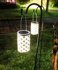 Solar Powered Outdoor Lanterns Waterproof White Table Lanterns Set Of 2 hanging on garden shepherd's hook at night
