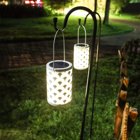 Solar Powered Outdoor Lanterns Waterproof White Table Lanterns Set Of 2 hanging on garden shepherd's hook at night