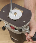 Heavy Duty Steel Guide Bush Measuring One Fifty Eight Millimeters secured to router base with wrench for tight grip routing.