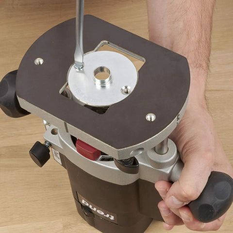 Heavy Duty Steel Guide Bush Measuring One Fifty Eight Millimeters secured to router base with wrench for tight grip routing.