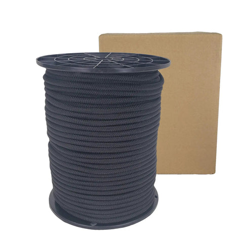 One Quarter Inch Black Shock Cord For Outdoor Use, Marine Grade Polyester Bungee Cord On A 250 Foot Spool in front of a cardboard box