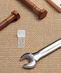 24 Piece Sofa Spring Repair Clips Kit For Heavy Duty Upholstery And Furniture Fixes, Silver Metal Clips on textured surface