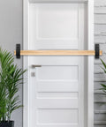 Heavy Duty Door Barricade Brackets Set For 2x4 Lumber U Shaped Gate Holder installed on white door with wood bar
