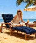 Beach scene with a woman on a navy blue Waterproof Outdoor Chaise Lounge Chair Cushion With Non Slip Ties For Patio Furniture