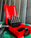 Front view of a 10-piece tungsten carbide burr set with 1/4" shanks in a red plastic case.