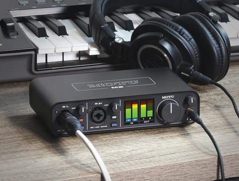 USB C Audio Interface With 2 Preamps And Hardware Monitoring 2 In 2 Out 24Bit 192kHz Recording Compatible With Mac Windows And iOS Black Studio Rig with headphones and keyboard.