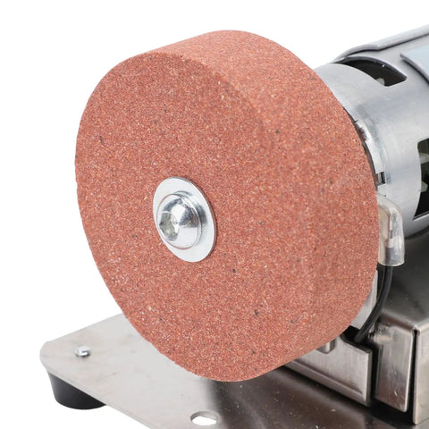 Close-up of abrasive disc on 7 Speed Mini Bench Grinder 100W Motor Electric Polishing And Grinding Machine for woodworking.