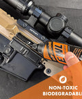 Extreme Weapons Lubricant EWL Synthetic CLP Gun Lube Spray 16oz bottle applied to rifle receiver and optic