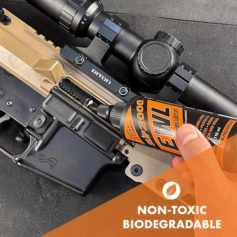 Extreme Weapons Lubricant EWL Synthetic CLP Gun Lube Spray 16oz bottle applied to rifle receiver and optic