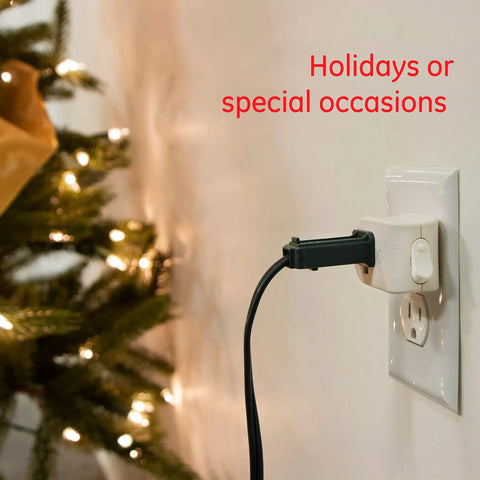 Grounded On Off Plug In Power Switch White Energy Efficient UL Listed 15A 120VAC 1800W connected to wall outlet near a lit tree