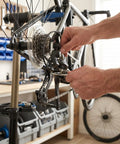 Close-up of mechanic installing 7/8 Speed Rear Derailleur Direct Mount For Mountain And Road Bikes Universal Replacement
