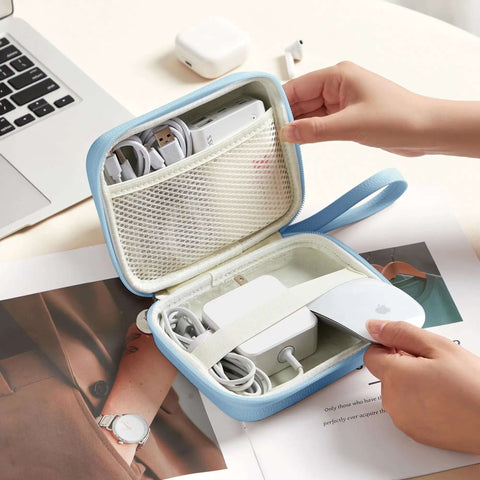 Slick Grab And Go Tech Organizers For Macbook Gear Hella Compact Cable Carrier Pouch For Chargers Adapters Power Banks And USB Drives Blue Travel Storage Case That Never Falls Apart with zipped compartments holding cables and charger.
