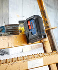 Green Beam Self Leveling Alignment Laser Pro Grade With Plumb And Level Point Projection on a construction site ladder