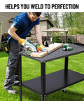 Man using Heavy Duty Steel Welding Table 36 X 19 inch surface for cutting wood in backyard, featuring tools and stability.