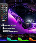 Aura Aluminum Car Underglow Lights With Remote Control illuminating a sports car with multicolor neon glow at night.