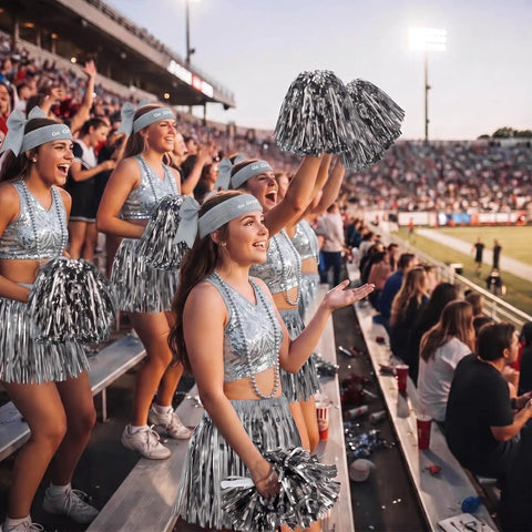 Girls wearing 73 Piece Silver Spirit Wear Kit for Girls With Bulk Pep Rally Essentials including pom poms and headbands in stadium stands.