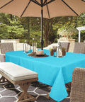 Outdoor Tablecloth With Zipper Umbrella Hole For 60 By 84 Inch Tables Waterproof And Wrinkle Free Stain Resistant Polyester Aqua Blue Easy Install And Spill Proof Protects Patio Garden Dinners For Picnics Or Parties on table under umbrella in garden setting