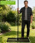 Man holding Lawn Leveling Rake With 72 Inch Non Slip Handle, 42 By 10 Inch Leveling Tool For Grass, Golf Course, dirt ground with rotating head