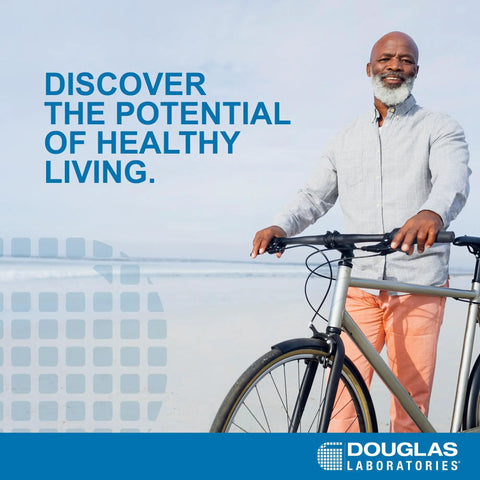 Man with bicycle on beach with text 'Discover the potential of healthy living.' Douglas Laboratories logo displayed.
