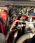 Heavy Duty 12V 140A Voltage Sensitive Relay Vsr Dual Battery Isolator installed in engine compartment with wiring connections.