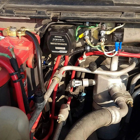 Heavy Duty 12V 140A Voltage Sensitive Relay Vsr Dual Battery Isolator installed in engine compartment with wiring connections.