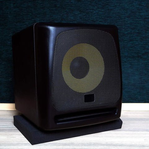 Studio monitor on heavy-duty acoustic foam pad, reducing vibration for 5 to 12 inch monitors and subwoofers, home studio setup.