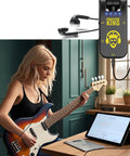 Woman using Compact 5W Guitar Headphone Amp with Built In DSP Distortion Timbre for Electric Guitars, connected to a guitar.