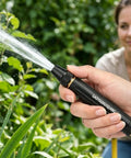 Person using Beast Mode High Pressure Water Gun Nozzle With 360 Degree Rotating Jet Spray in garden