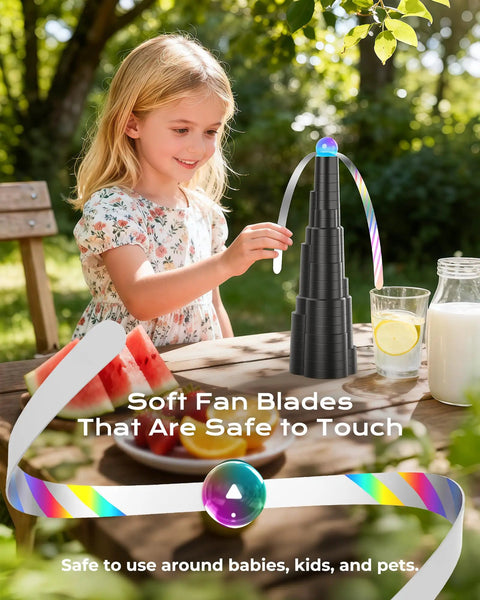 Girl using Tabletop Fly Fans With USB Type C Rechargeable Battery And Colorful LED Light Show, Foldable Soft Holographic Blades, outdoors.